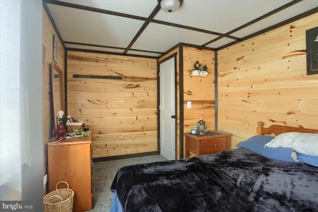 a house with lots of trees in the background