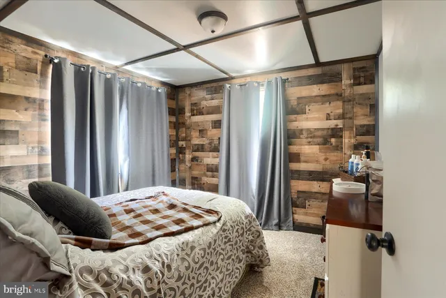 a view of a patio with table and chairs with wooden fence and floor