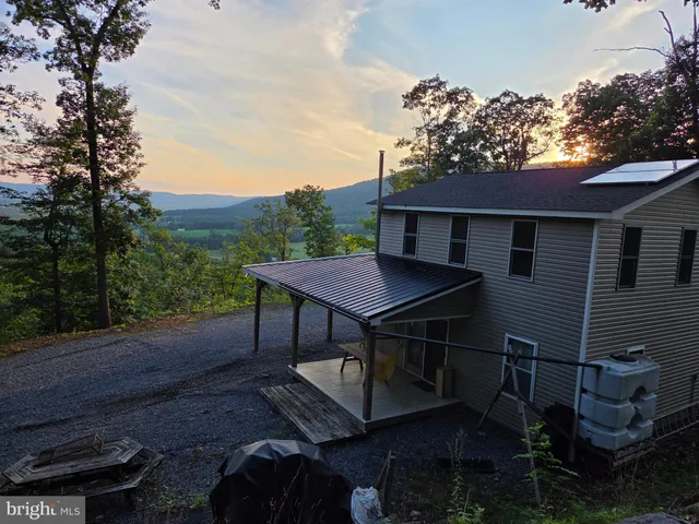 a view of field with trees in the background