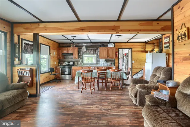 a kitchen with stainless steel appliances granite countertop sink stove top oven and cabinets
