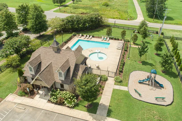 an aerial view of a house with outdoor space