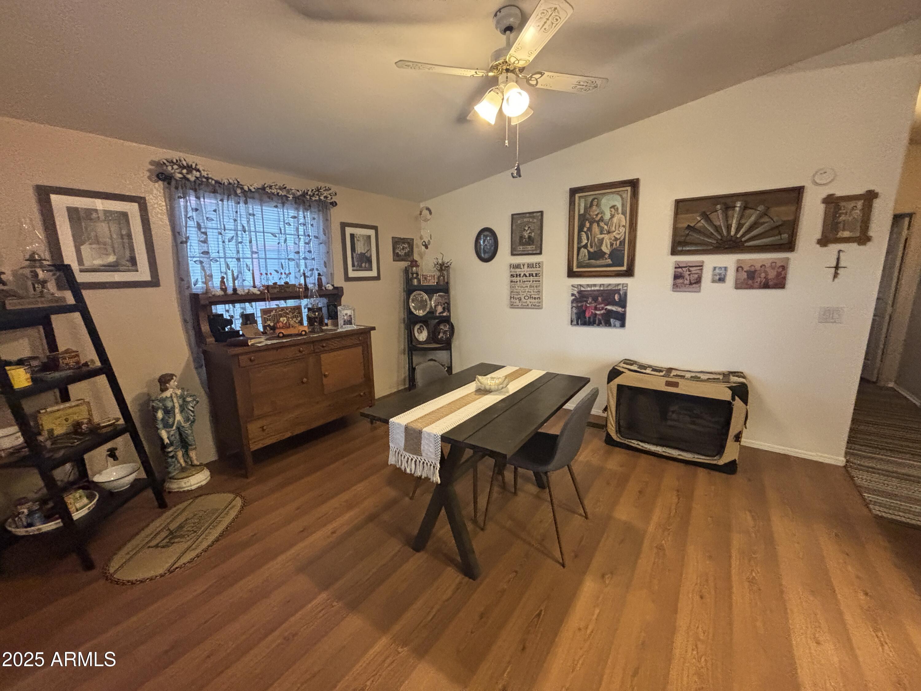 3500 South Tomahawk Road, Unit 153 Apache Junction, AZ 85119 - Photo 11 of 28 a living room with furniture and a wooden floor