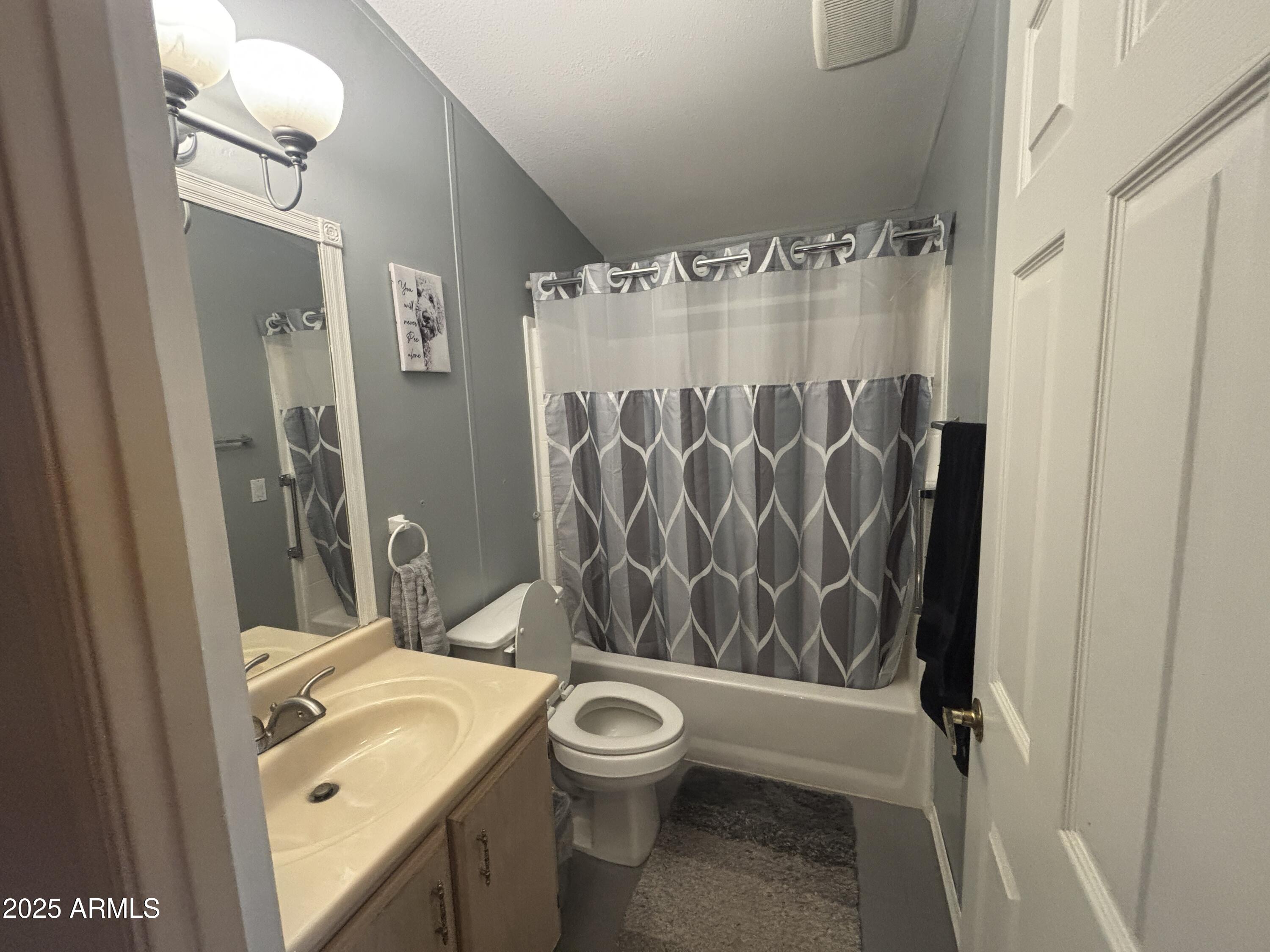 3500 South Tomahawk Road, Unit 153 Apache Junction, AZ 85119 - Photo 12 of 28 a bathroom with a granite countertop sink toilet and shower