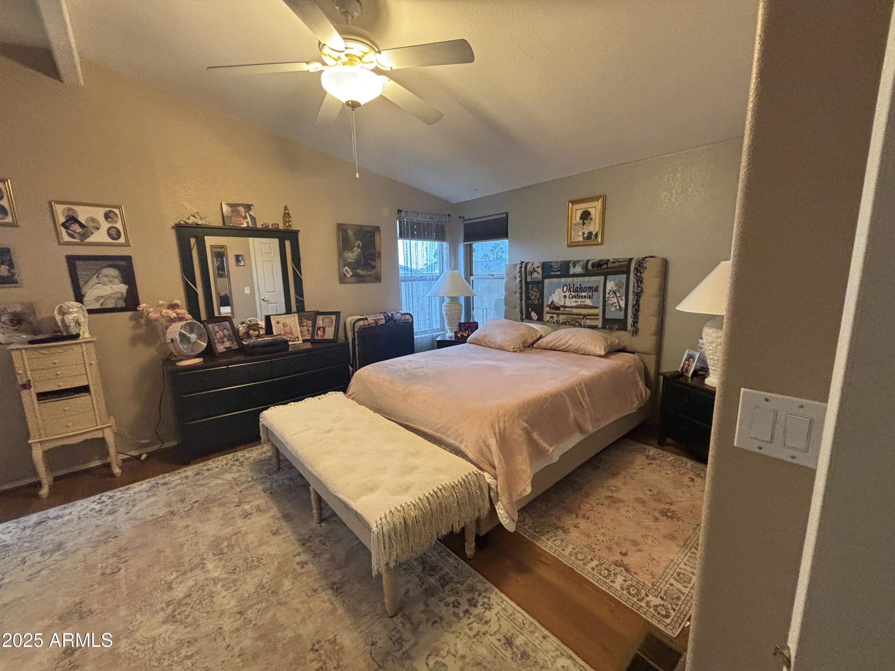 3500 South Tomahawk Road, Unit 153 Apache Junction, AZ 85119 - Photo 20 of 28 a bedroom with a bed and a dresser