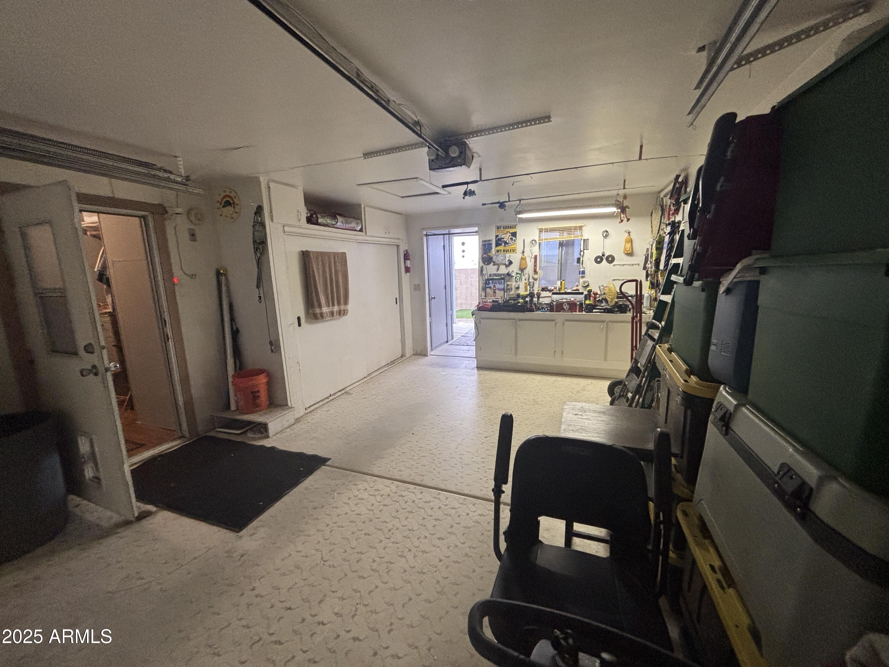 3500 South Tomahawk Road, Unit 153 Apache Junction, AZ 85119 - Photo 24 of 28 a room with stainless steel appliances kitchen island granite countertop furniture and a refrigerator