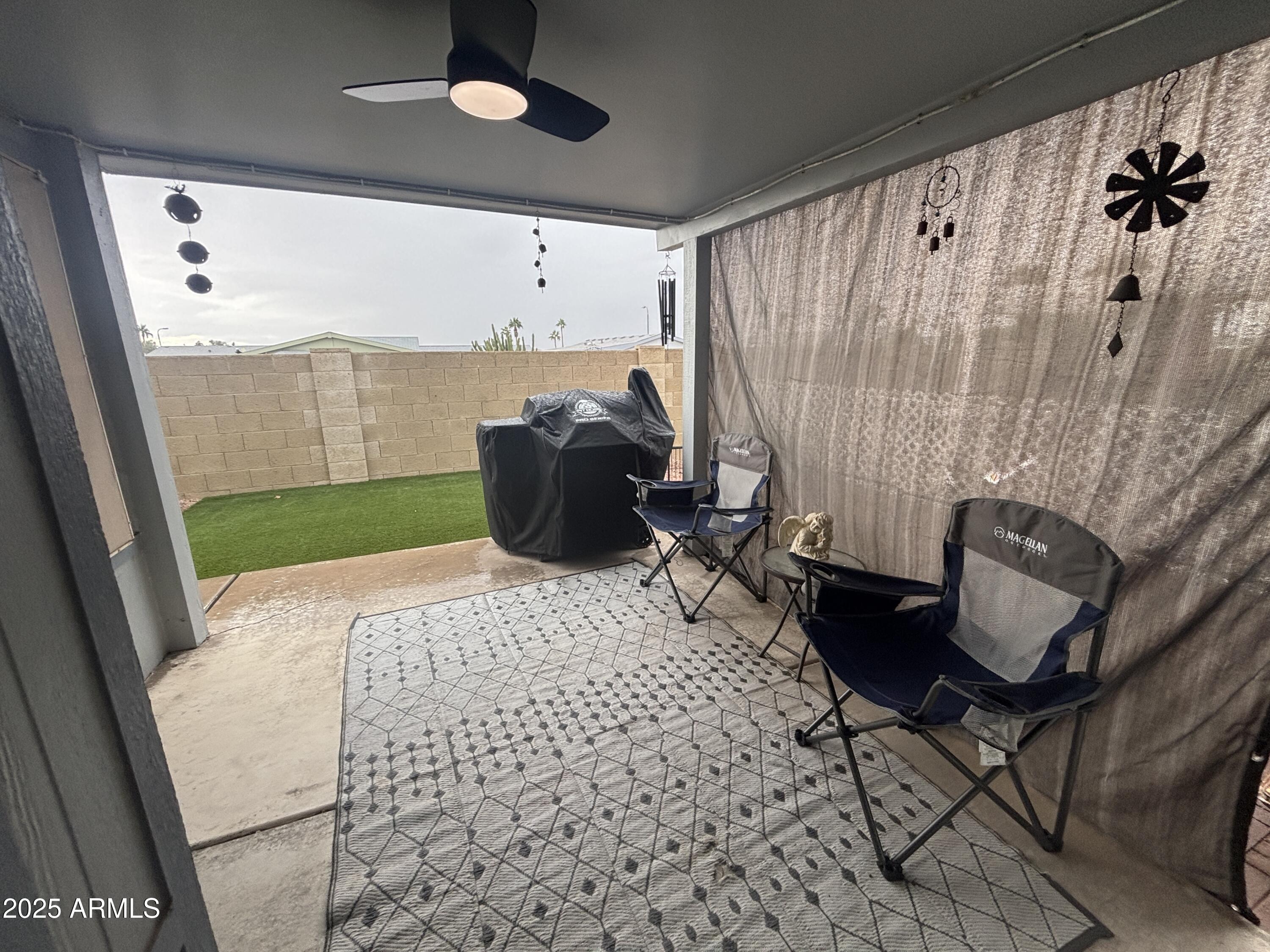 3500 South Tomahawk Road, Unit 153 Apache Junction, AZ 85119 - Photo 25 of 28 a room with furniture and a rug
