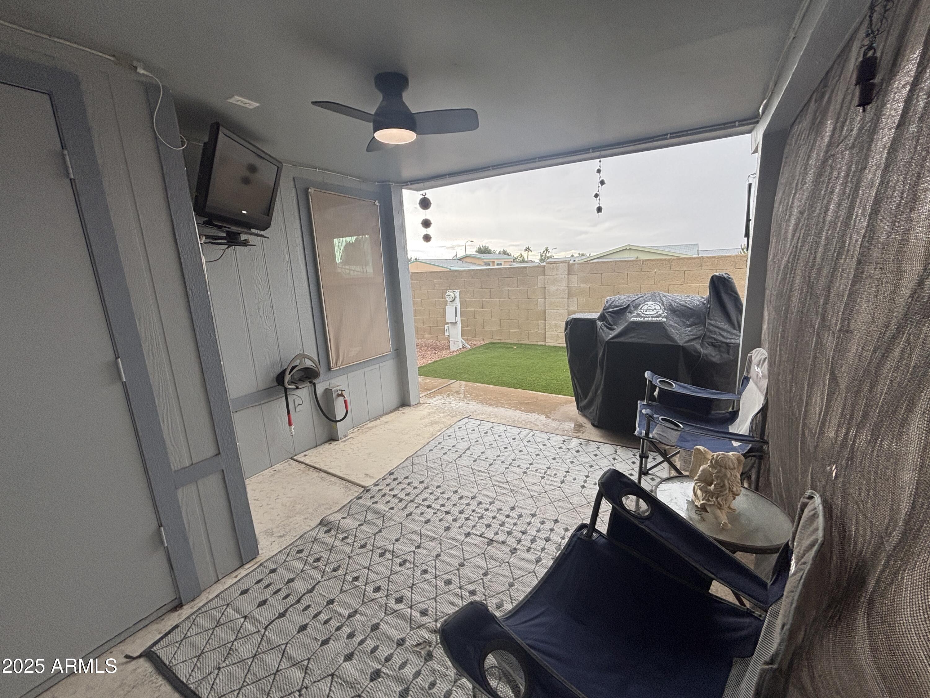 3500 South Tomahawk Road, Unit 153 Apache Junction, AZ 85119 - Photo 26 of 28 a living room with furniture rug and a window