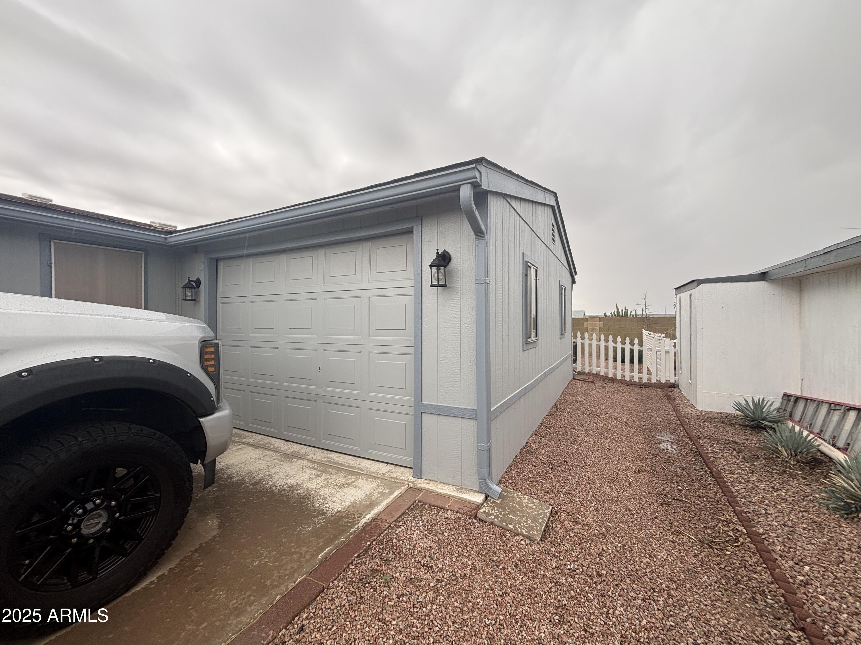 3500 South Tomahawk Road, Unit 153 Apache Junction, AZ 85119 - Photo 4 of 28 a view of a car garage