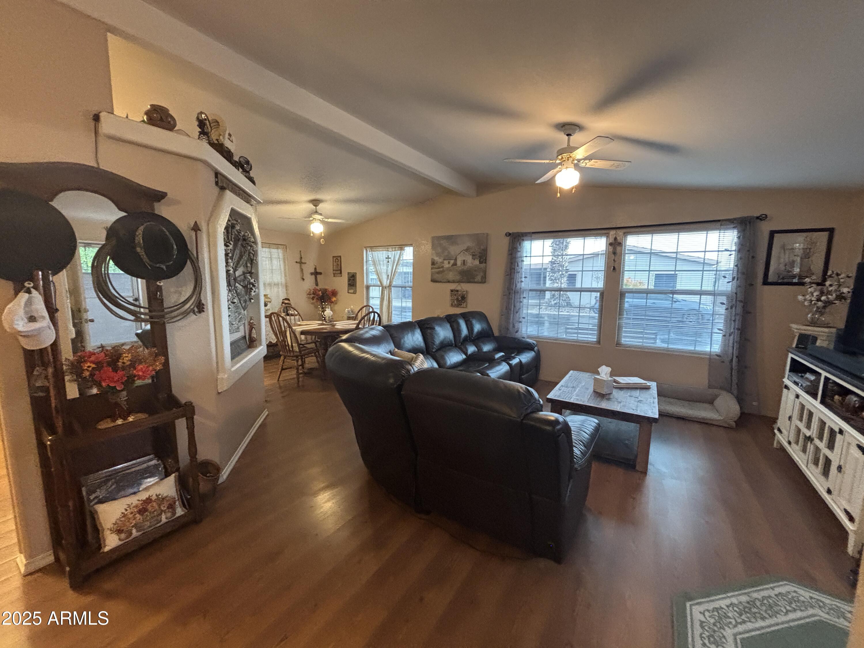 3500 South Tomahawk Road, Unit 153 Apache Junction, AZ 85119 - Photo 8 of 28 a living room with furniture and a flat screen tv
