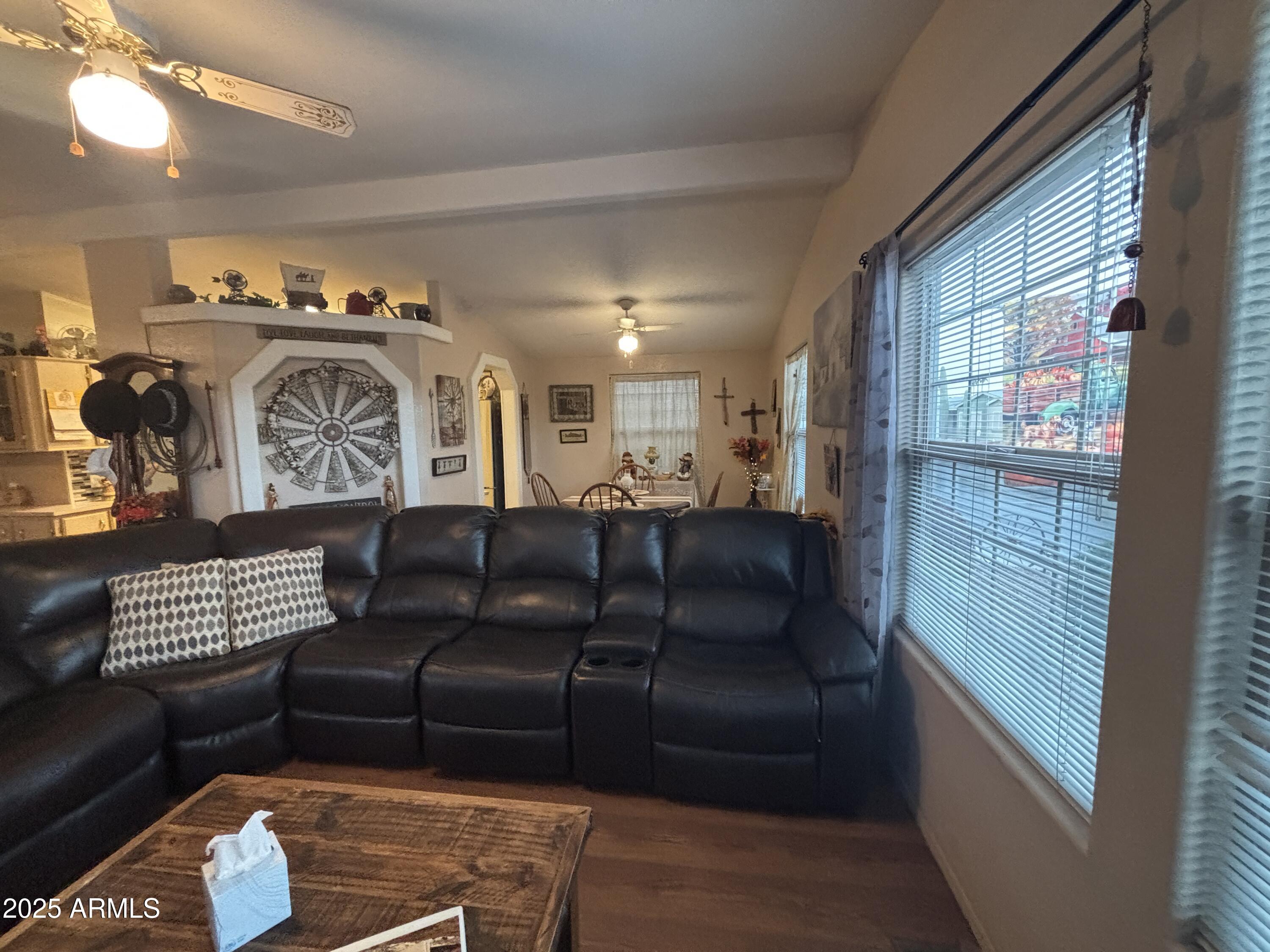 3500 South Tomahawk Road, Unit 153 Apache Junction, AZ 85119 - Photo 9 of 28 a view of a livingroom with furniture and staircase