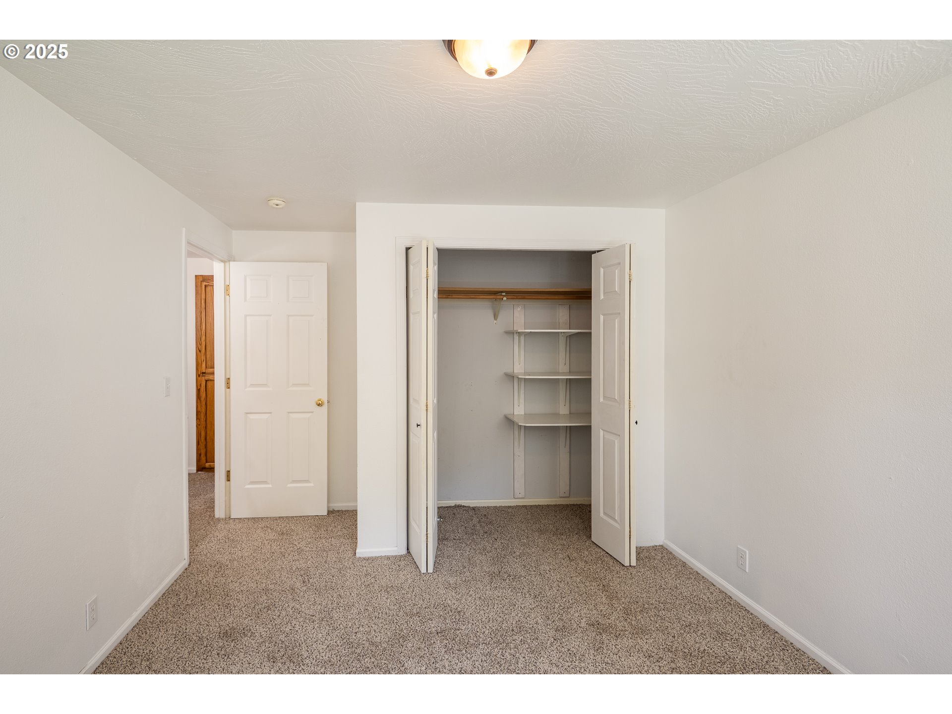 7015 South E Street Springfield, OR 97478 - Photo 15 of 22 a view of an empty room and a kitchen