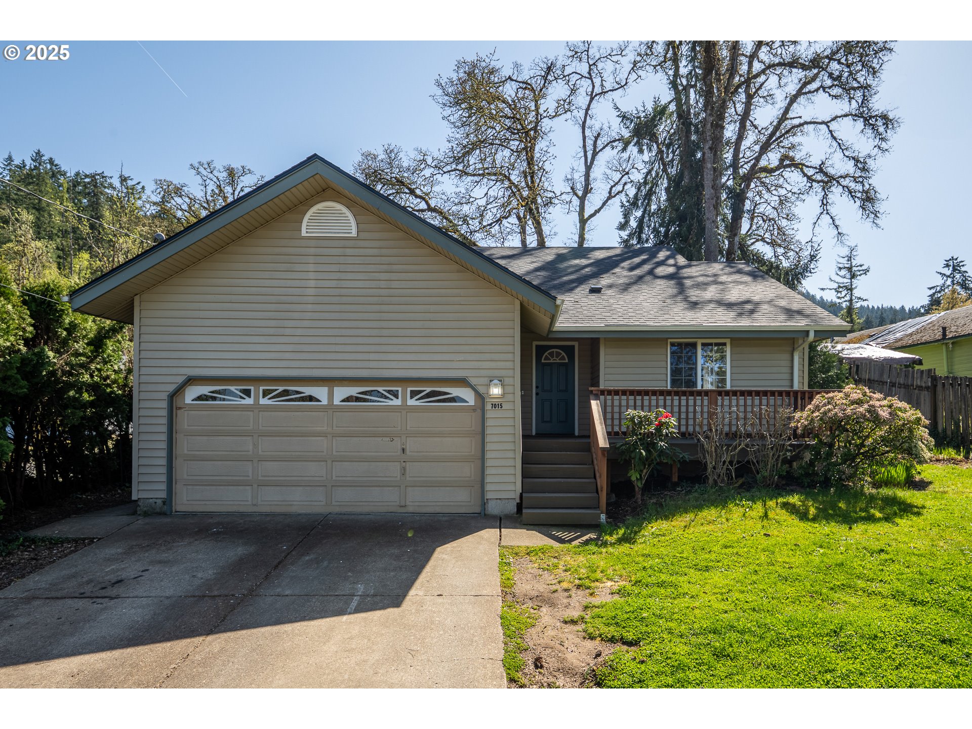 7015 South E Street Springfield, OR 97478 - Photo 2 of 22 a view of a house with a yard
