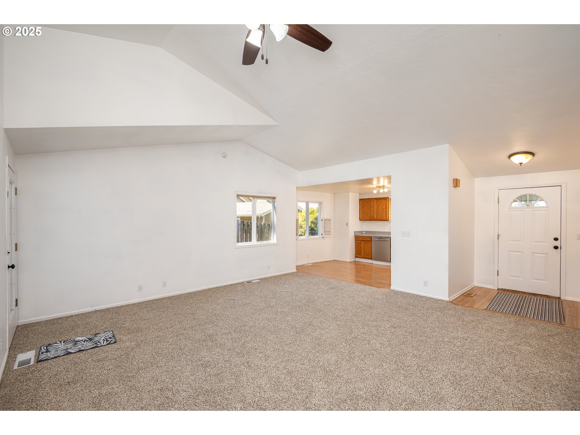 7015 South E Street Springfield, OR 97478 - Photo 5 of 22 a view of empty room with wooden floor and fan