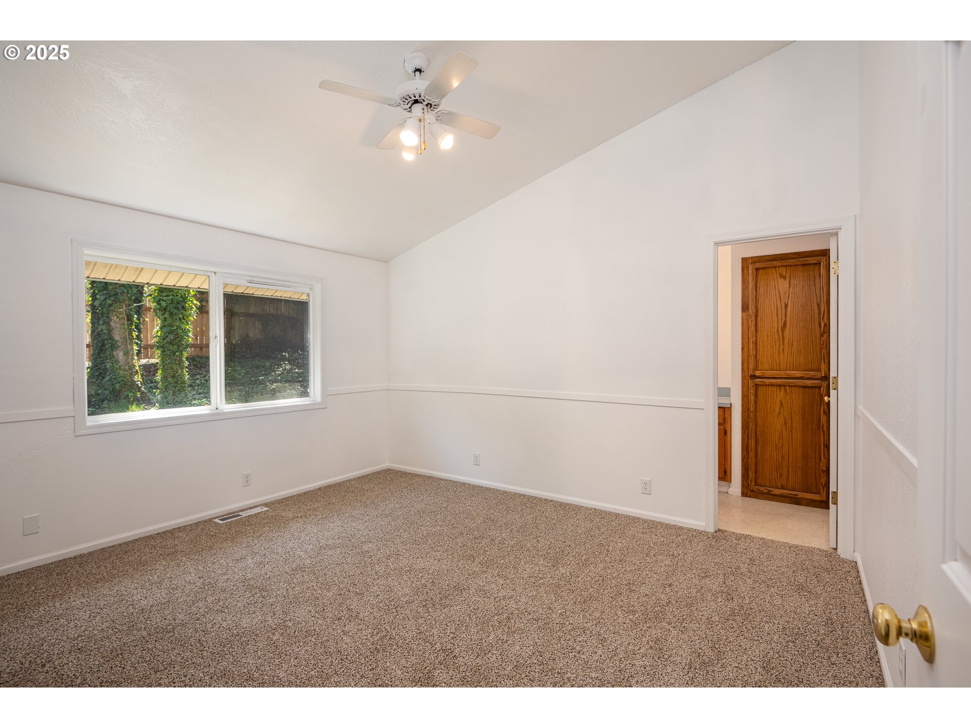 7015 South E Street Springfield, OR 97478 - Photo 10 of 22 a view of an empty room with a window