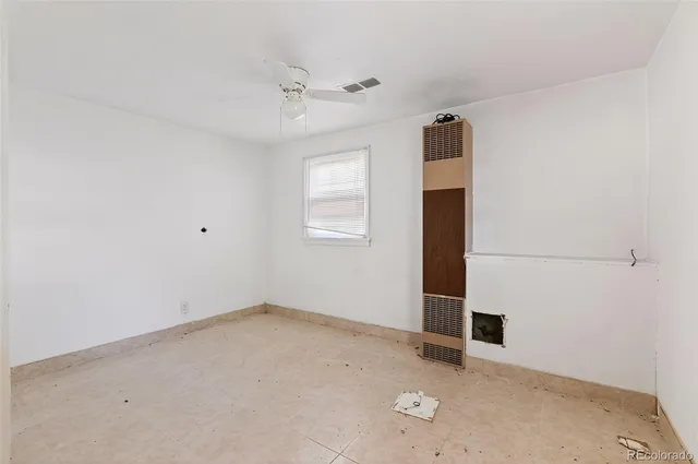 a view of a yard with plants and trees