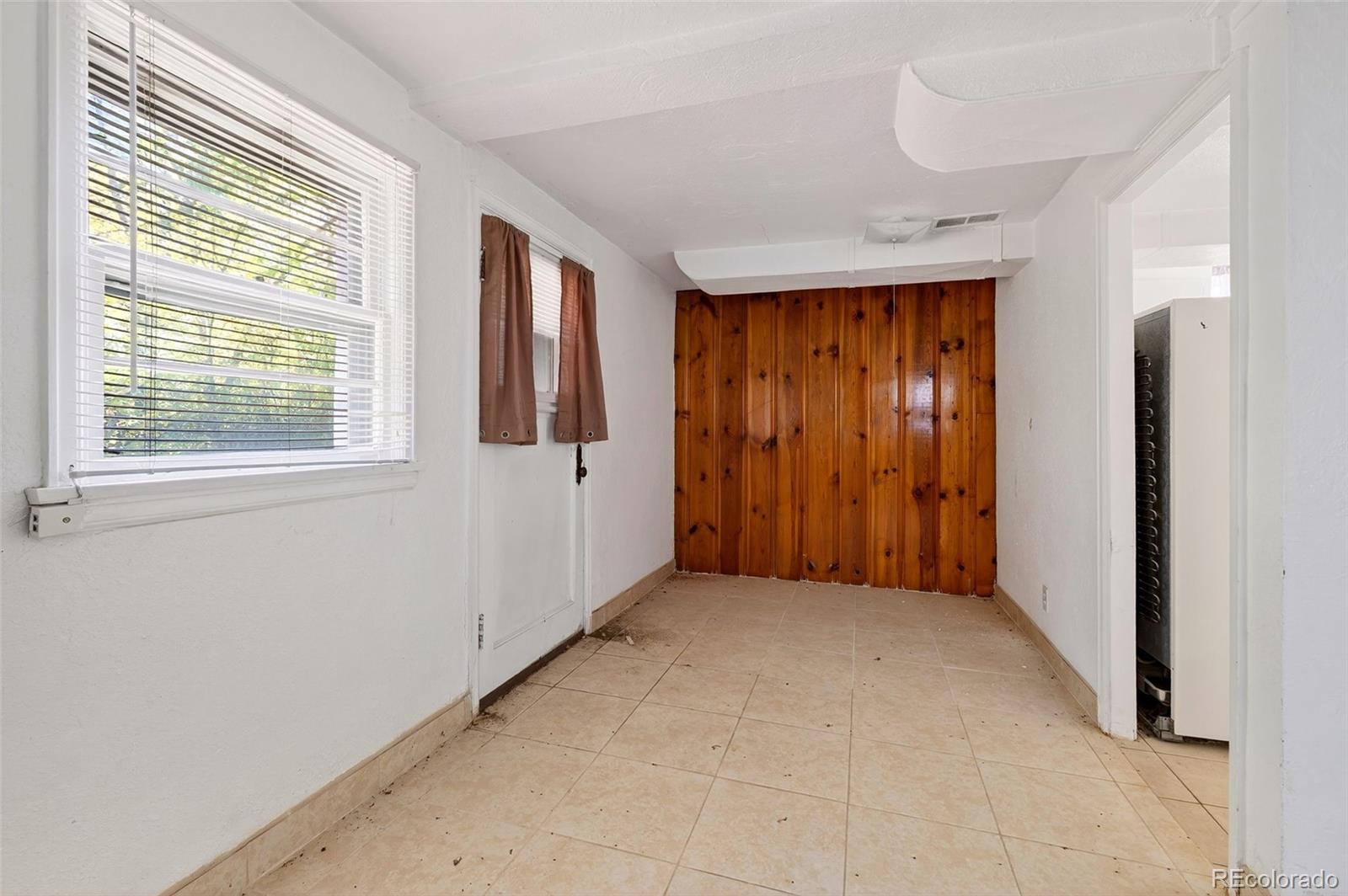 6795 West 31st Avenue Wheat Ridge, CO 80214 - Photo 18 of 35 a view of an empty room with a window
