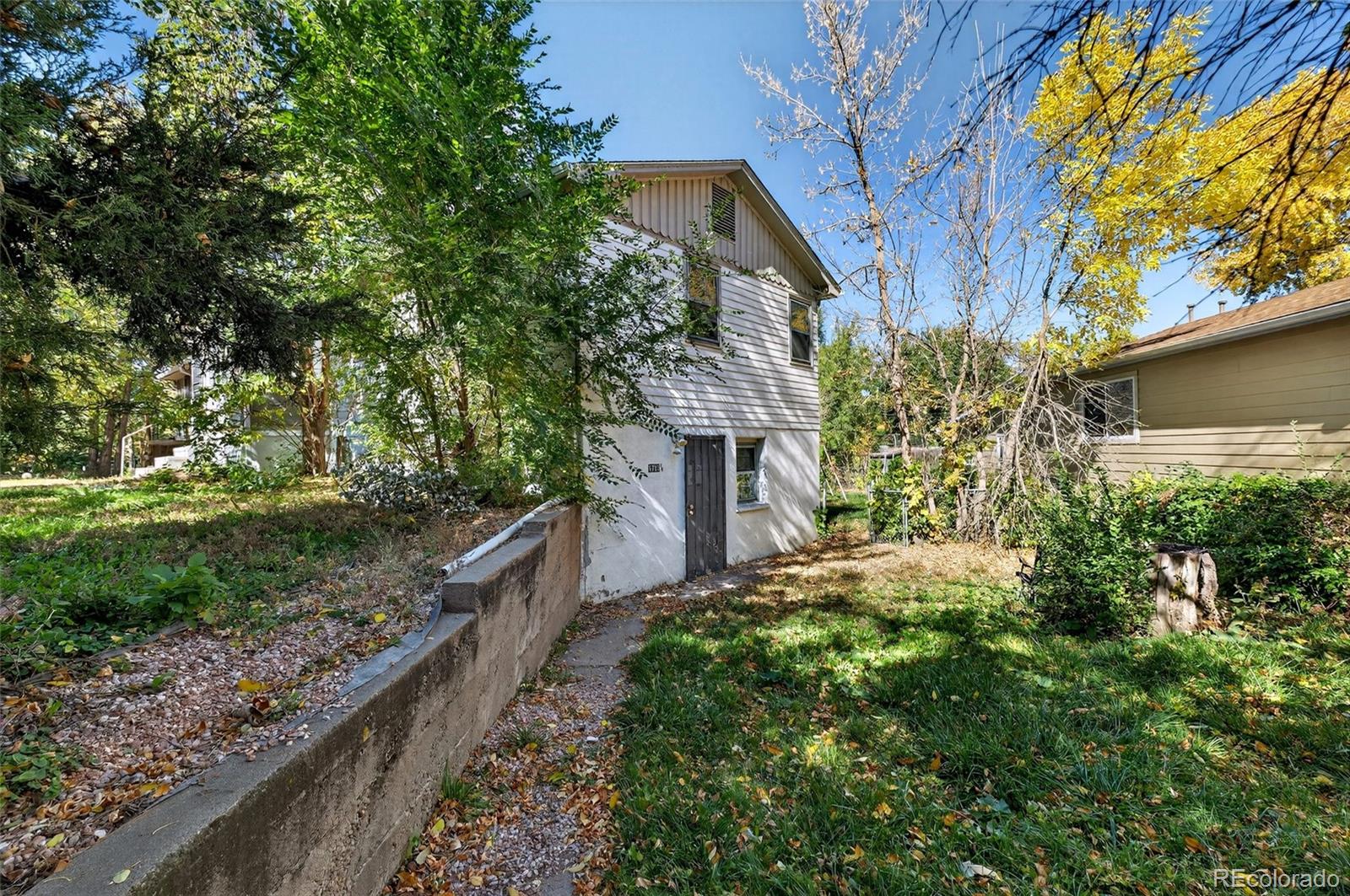 6795 West 31st Avenue Wheat Ridge, CO 80214 - Photo 25 of 35 a view of a house with a yard and pathway