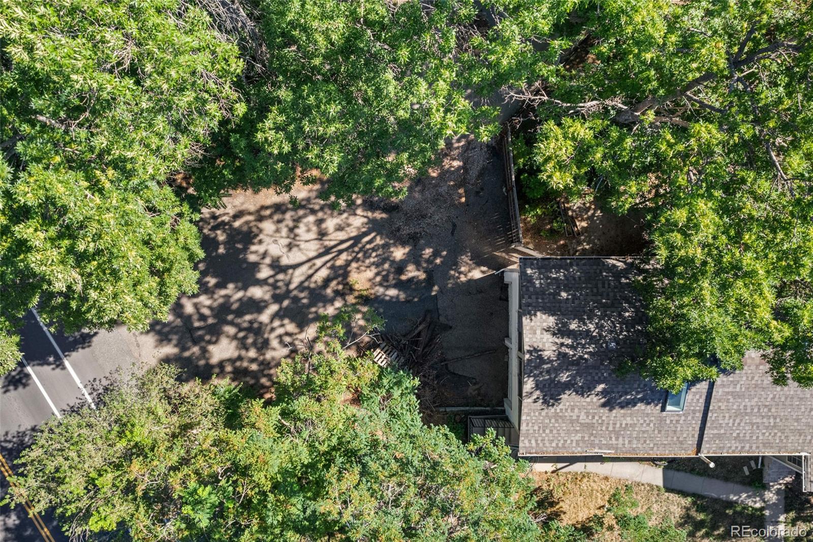 6795 West 31st Avenue Wheat Ridge, CO 80214 - Photo 34 of 35 a backyard of a house with lots of green space