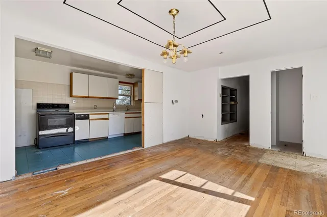 a view of a kitchen with a stove cabinets and wooden floor