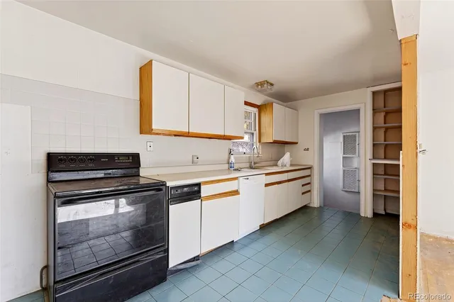 a kitchen with granite countertop cabinets and steel stainless steel appliances
