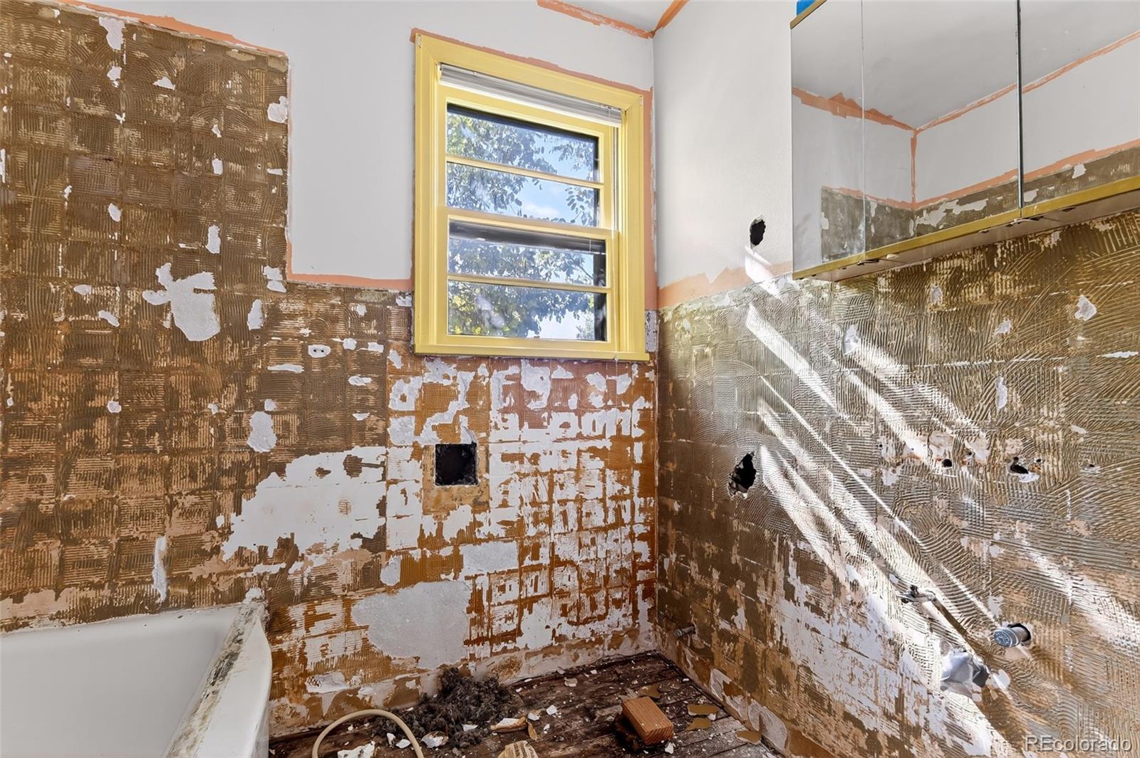 6795 West 31st Avenue Wheat Ridge, CO 80214 - Photo 10 of 35 a bathroom with a shower