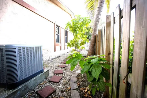a backyard with potted plants