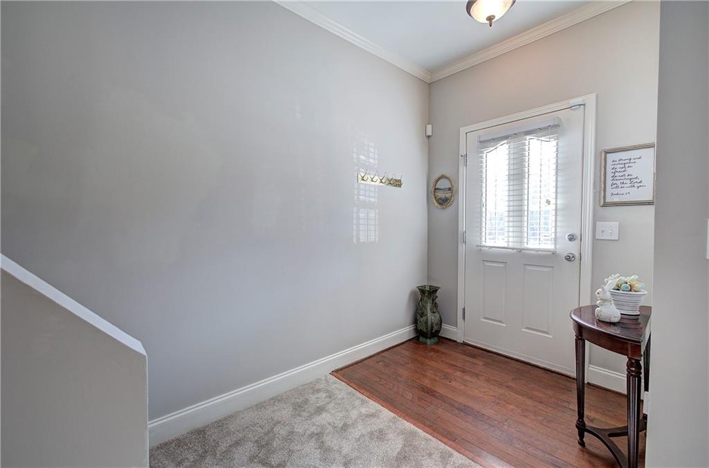618 Manor Way Cartersville, GA 30120 - Photo 2 of 35 a view of a room with wooden floor and a window