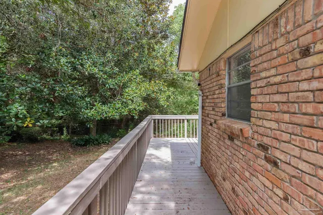 a balcony with view of trees