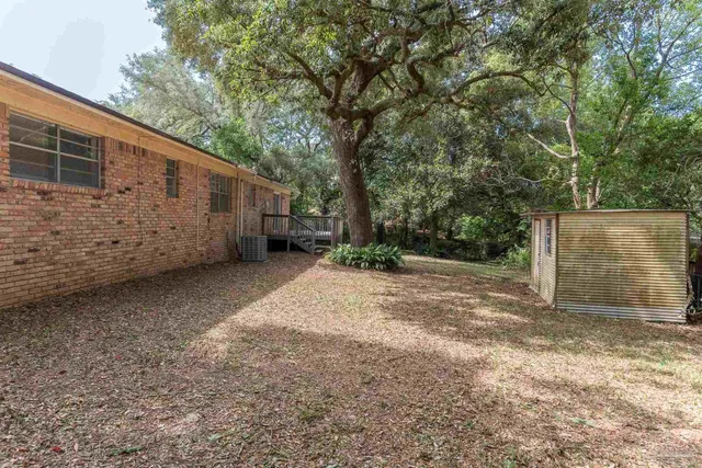 a view of a back yard of the house