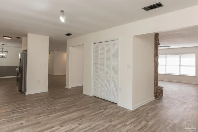 a view of a livingroom with wooden floor