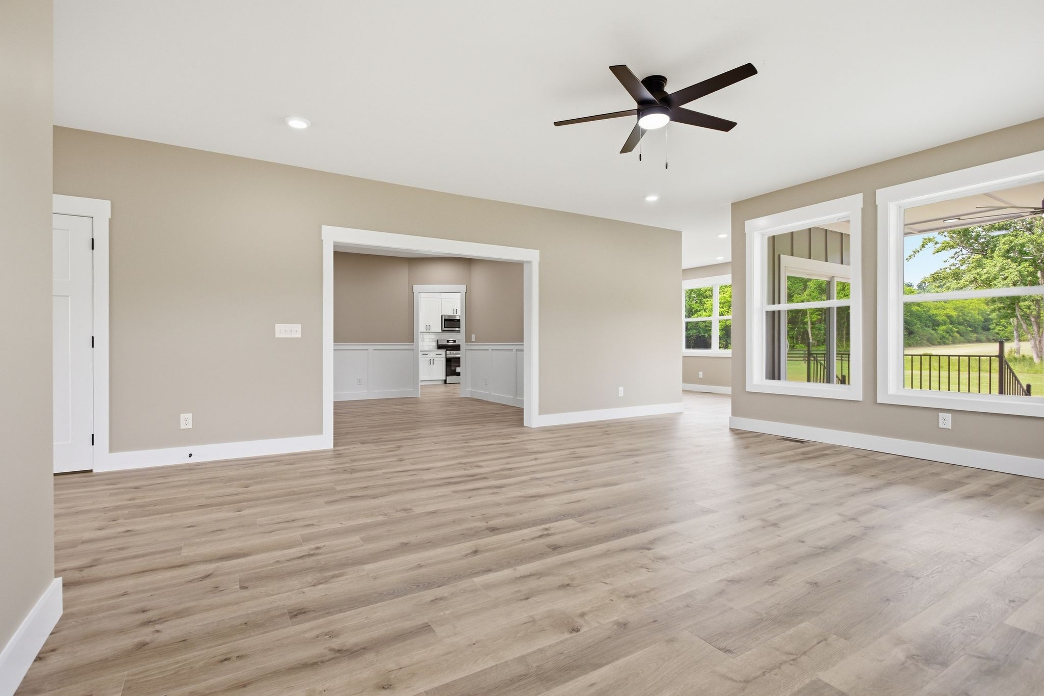 3319 Booker Ridge Road Mount Pleasant, TN 38474 - Photo 17 of 51 a view of an empty room with wooden floor and a ceiling fan