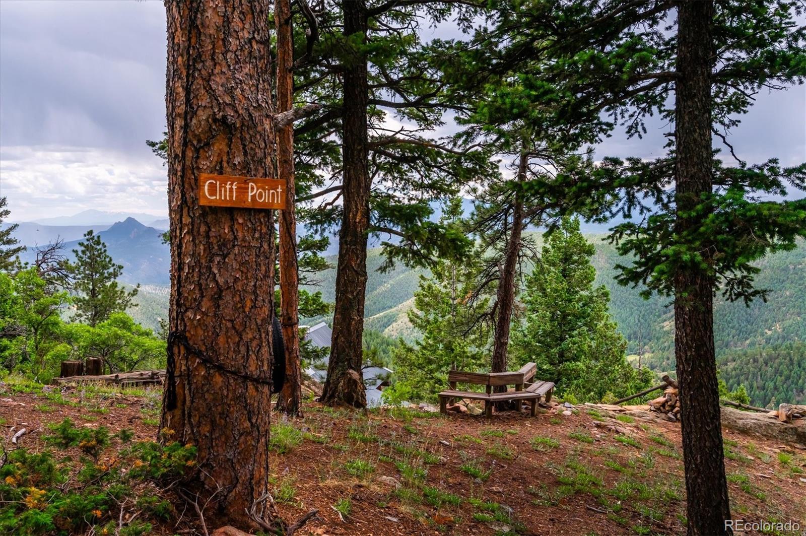 12973 Upper Ridge Road Conifer, CO 80433 - Photo 37 of 46 a car parked in front of a house