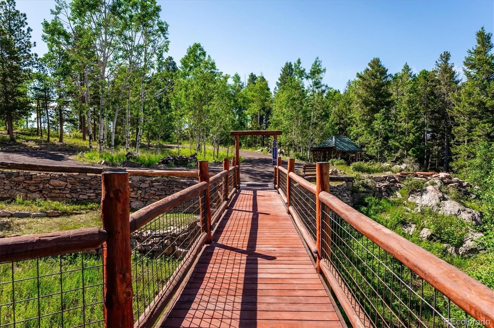 12973 Upper Ridge Road Conifer, CO 80433 - Photo 46 of 46 a view of balcony and wooden floor