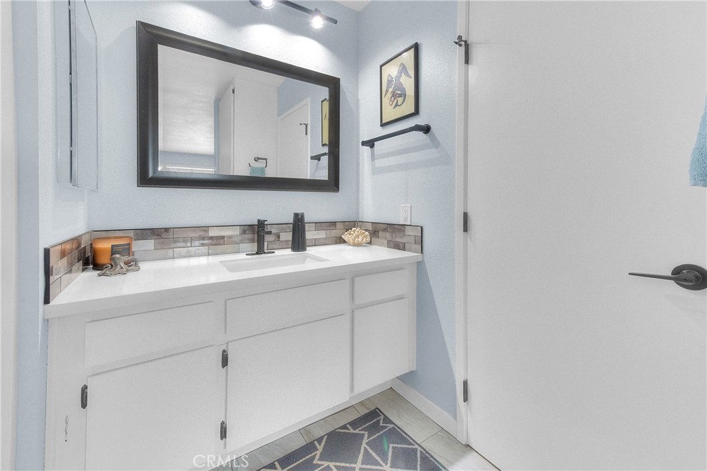6351 Riverside Drive, Unit 69 Chino, CA 91710 - Photo 13 of 21 a bathroom with a sink vanity and mirror