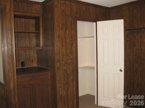 a bathroom with a shower and a door