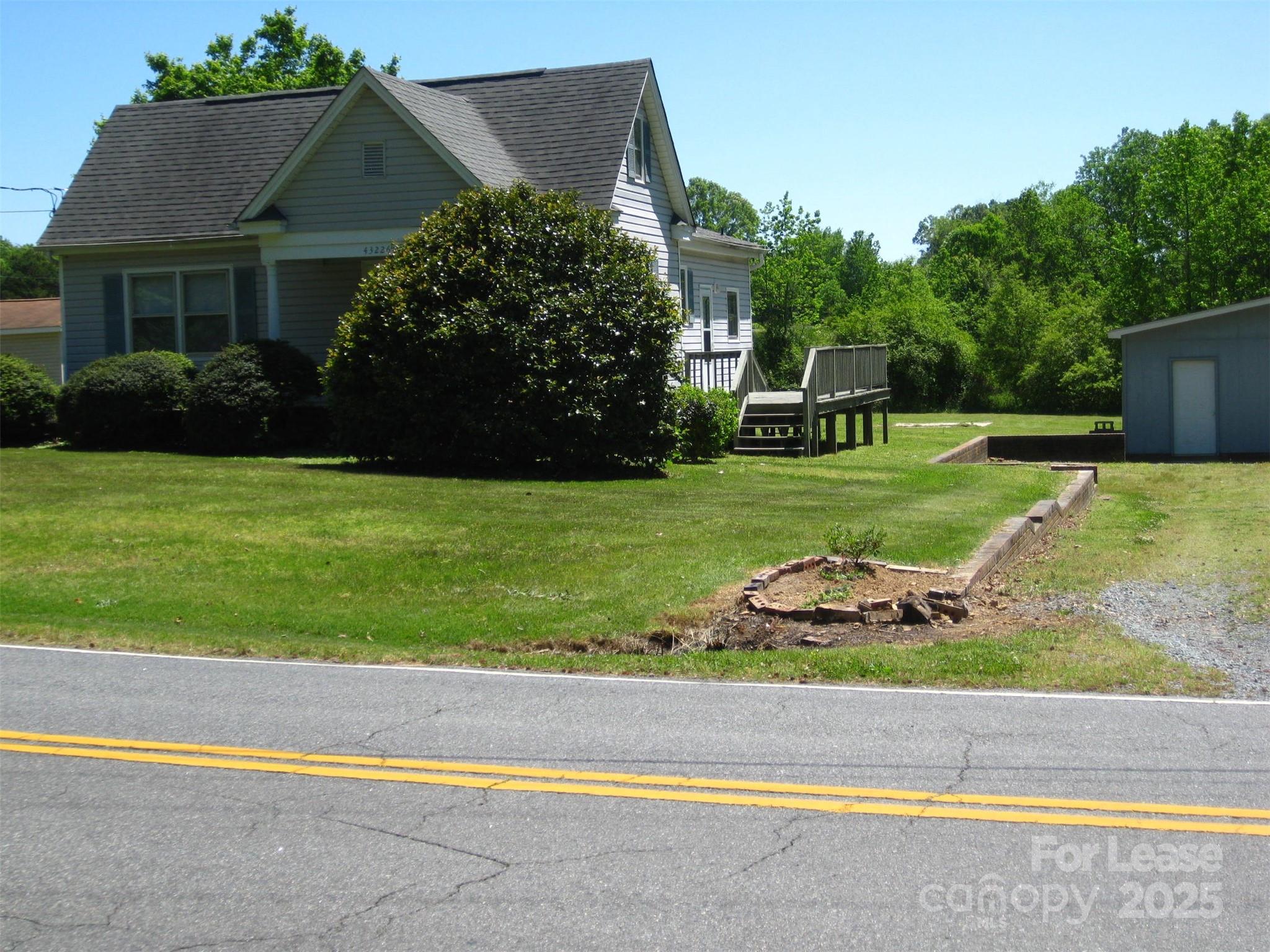 43226 Morrow Mountain Road Albemarle, NC 28001 - Photo 2 of 15 a front view of a house with a yard