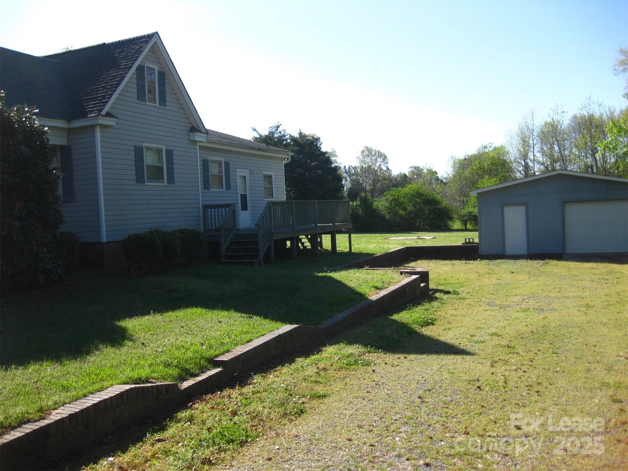 43226 Morrow Mountain Road Albemarle, NC 28001 - Photo 3 of 15 a front view of a house with garden