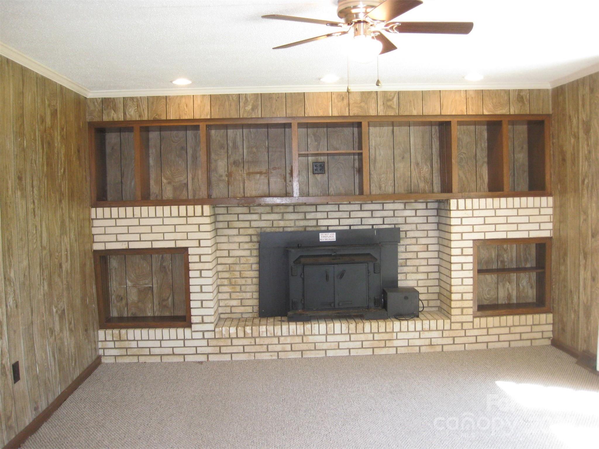 43226 Morrow Mountain Road Albemarle, NC 28001 - Photo 7 of 15 a view of a kitchen with a sink and a fireplace