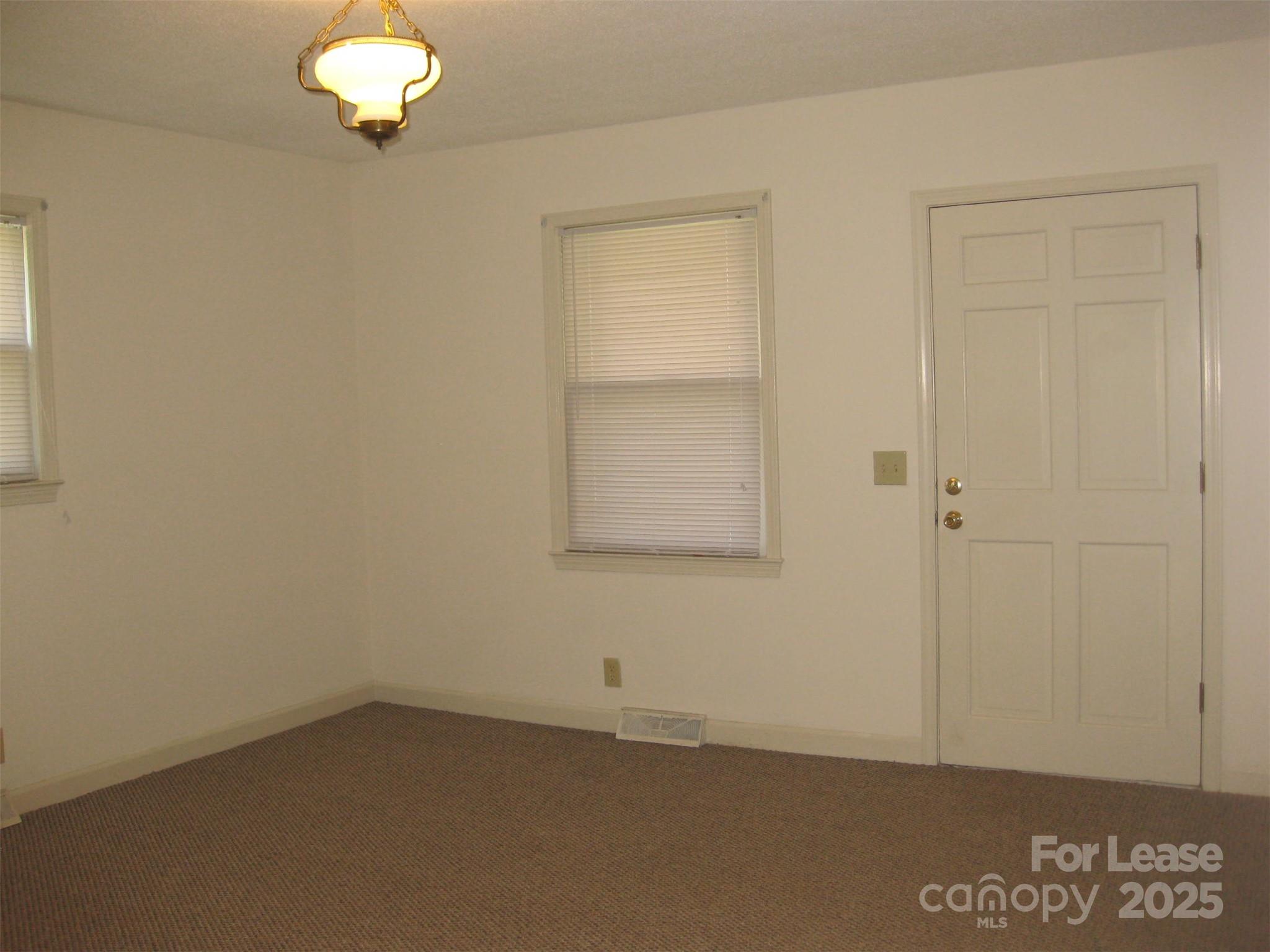 43226 Morrow Mountain Road Albemarle, NC 28001 - Photo 9 of 15 an empty room with a window