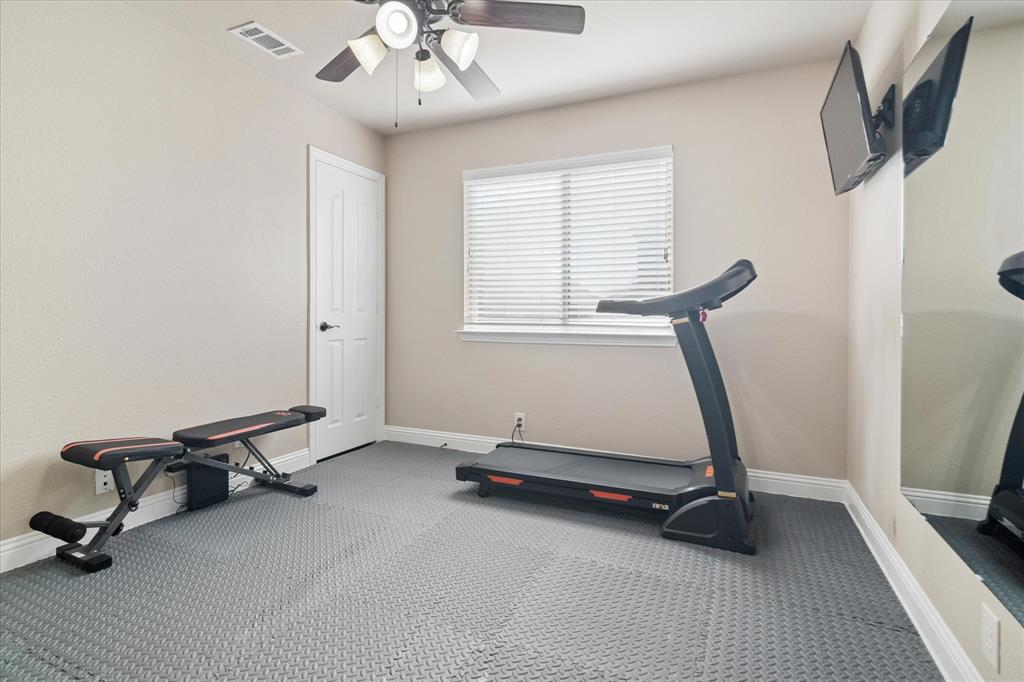 909 Calder Court Anna, TX 75409 - Photo 17 of 39 1st floor Guest room serving as an exercise room.