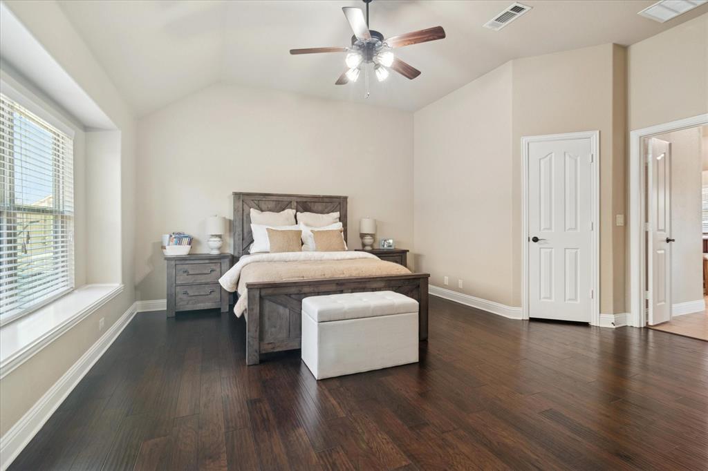 909 Calder Court Anna, TX 75409 - Photo 20 of 39 Beautiful wood flooring in the primary bedroom.