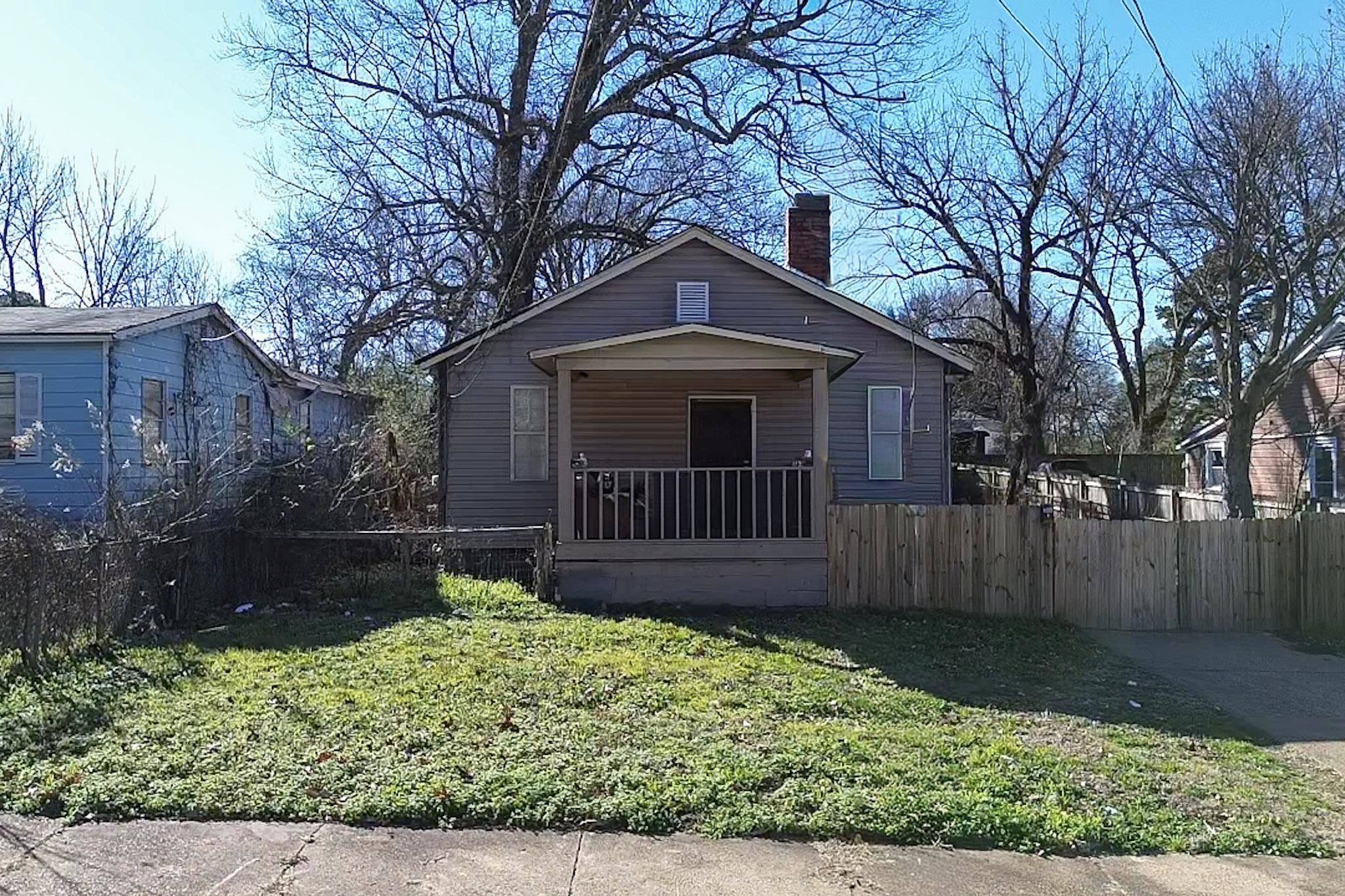 3561 Orchi Road Memphis, TN 38108 - Photo 1 of 1 Bungalow-style house with a chimney and a porch