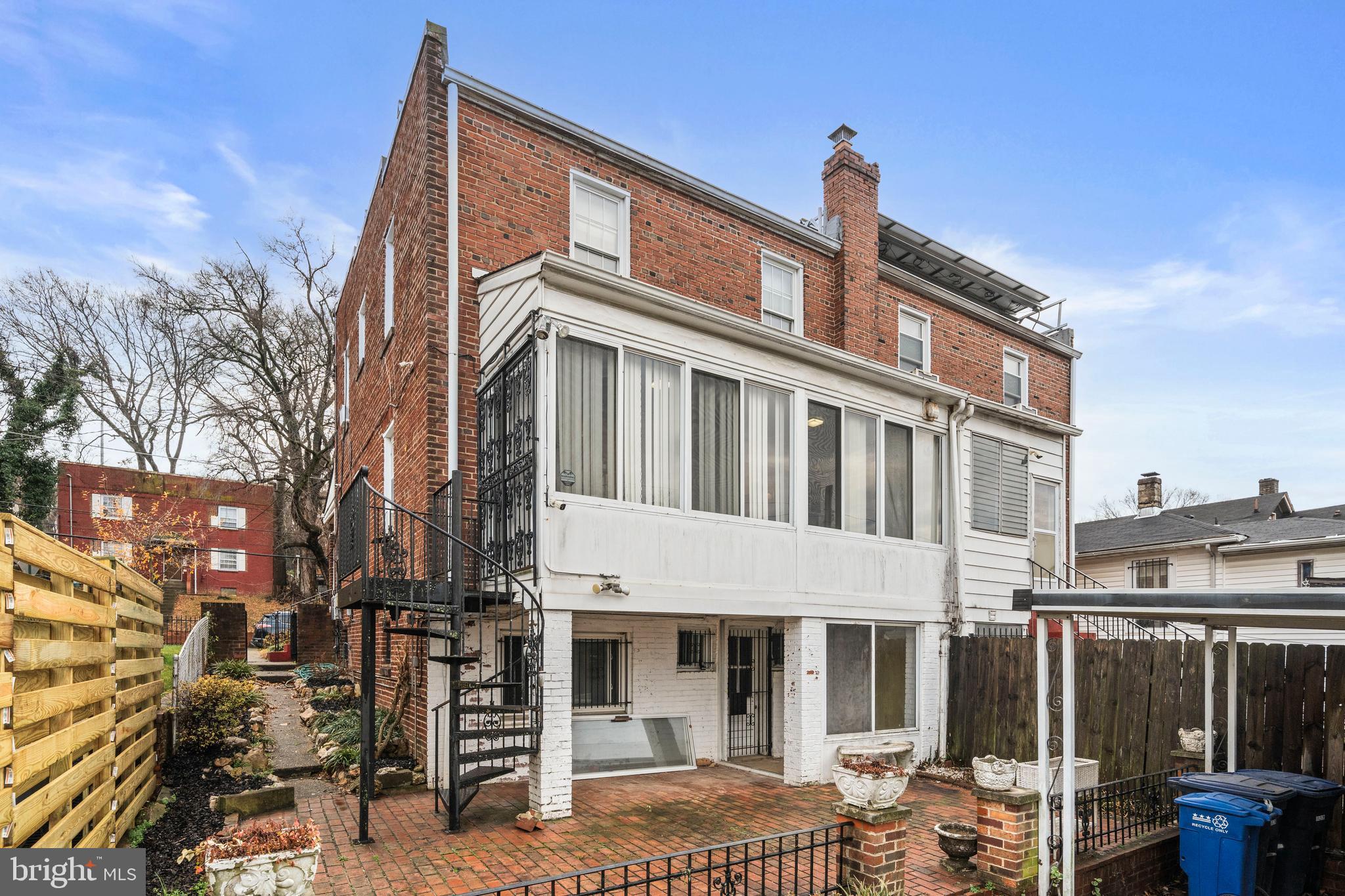 4108 Grant Street Northeast Washington, DC 20019 - Photo 28 of 31 a front view of a building with balcony