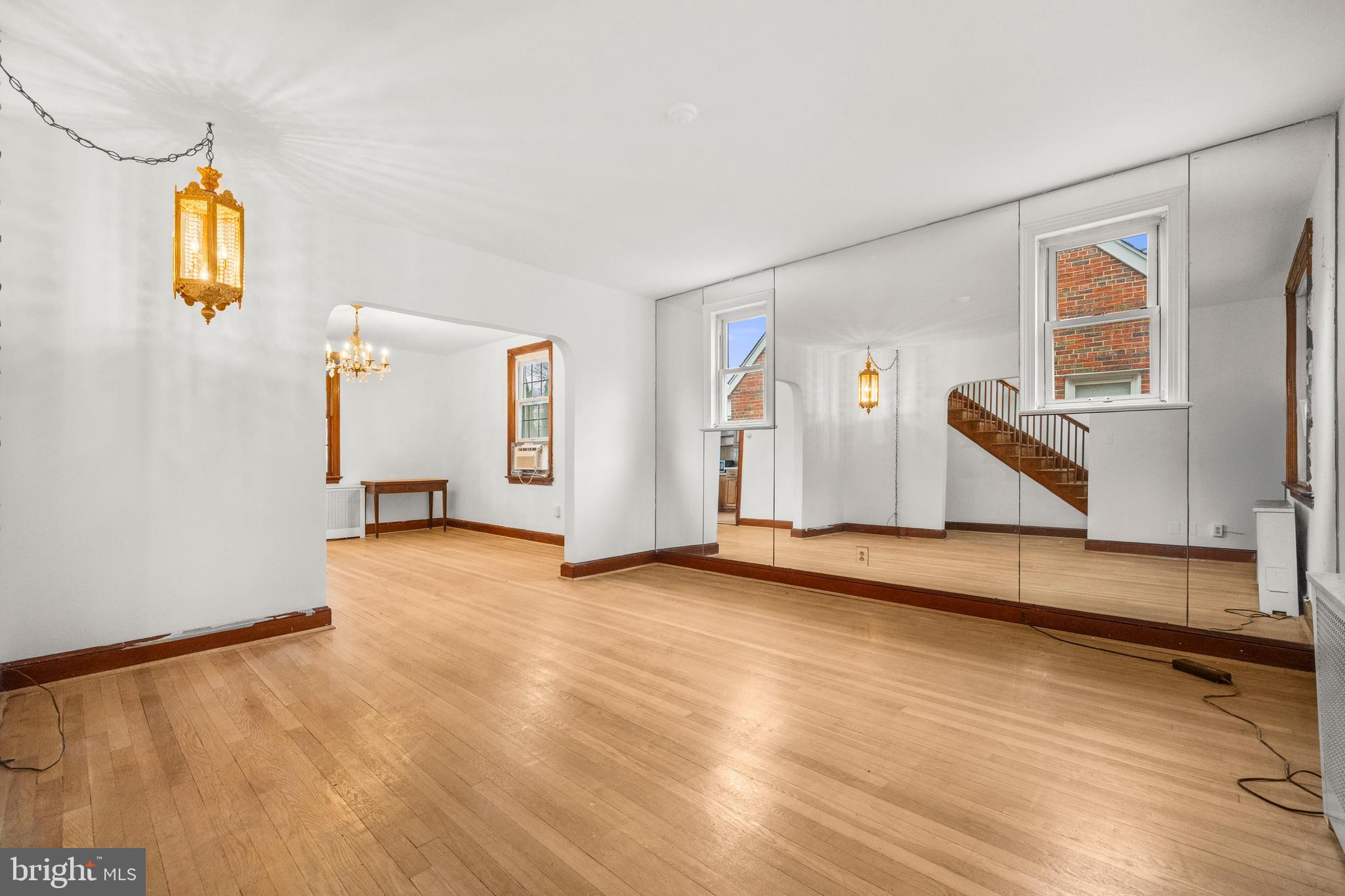 4108 Grant Street Northeast Washington, DC 20019 - Photo 7 of 31 a view of an empty room with window and wooden floor