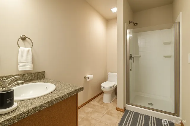 a living room with furniture and stairs