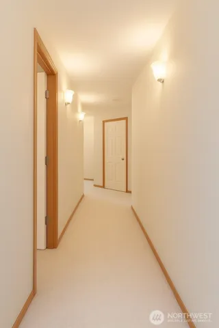 a bedroom with a bed and a television