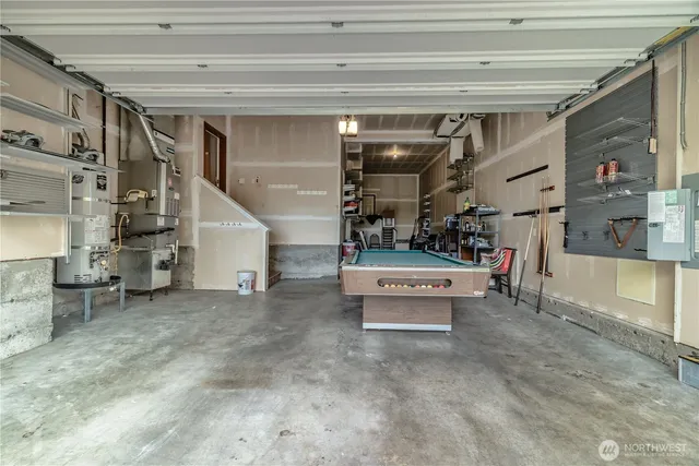 a living room with a balcony furniture and a fireplace