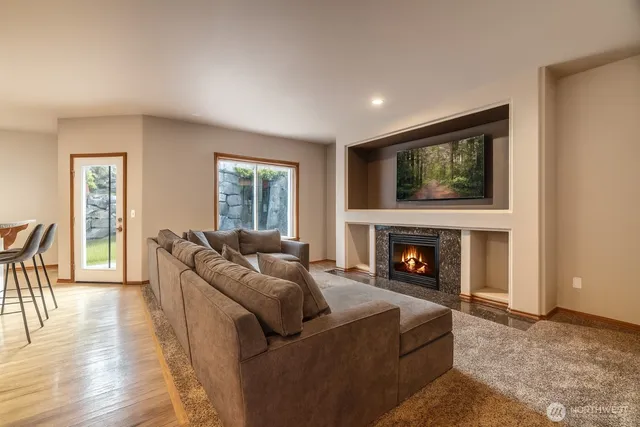 a living room with couches and a fireplace