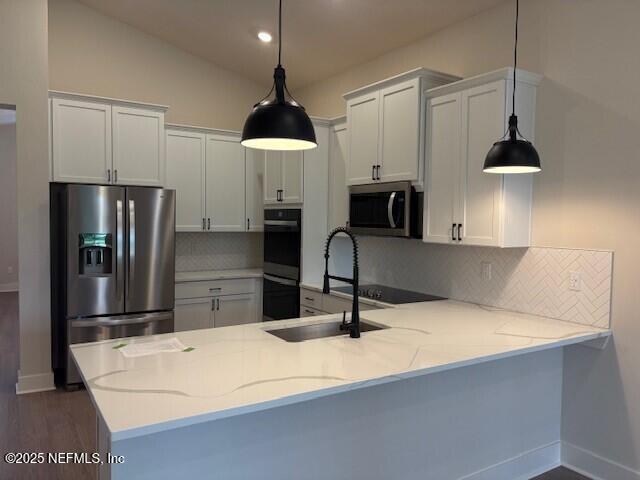 8495 Ford Road Bryceville, FL 32009 - Photo 2 of 15 a kitchen with stainless steel appliances a refrigerator and a sink