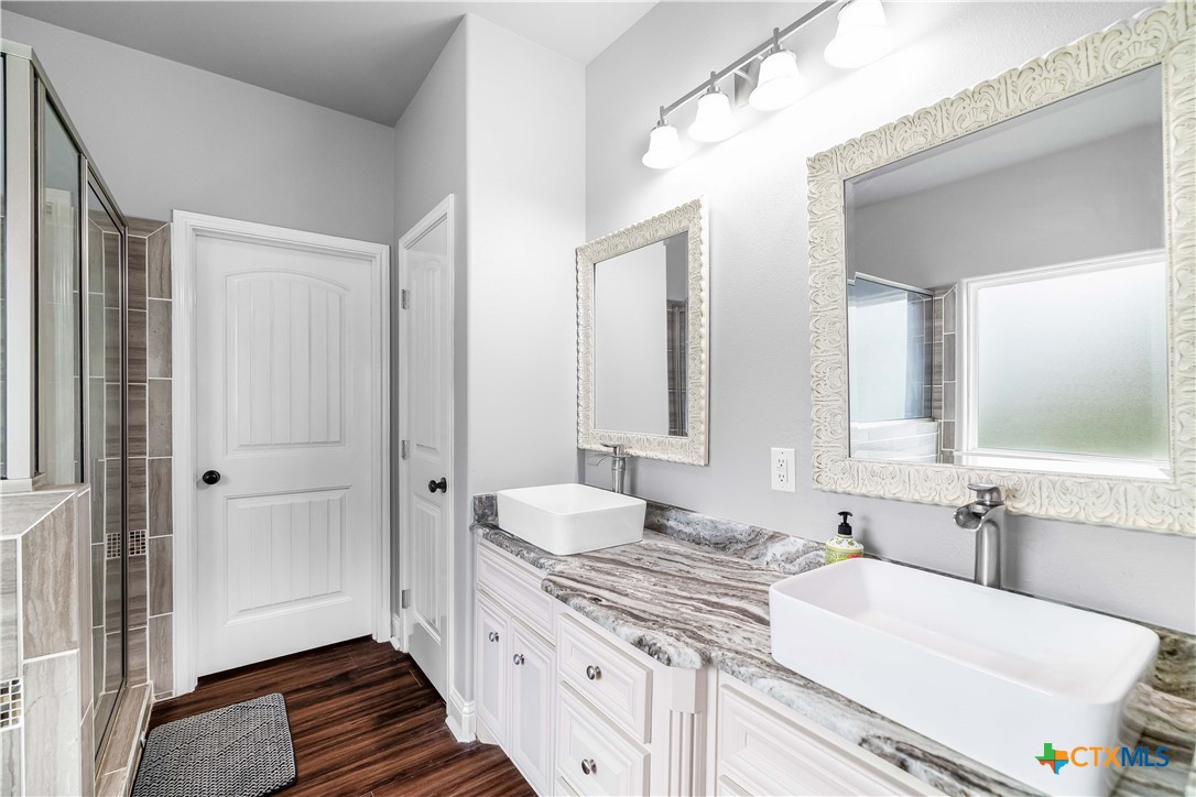 204 James Street Inez, TX 77968 - Photo 19 of 35 a bathroom with a sink and a mirror